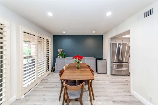 dining area featuring light wood-type flooring