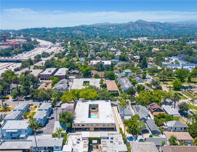 birds eye view of property with a mountain view