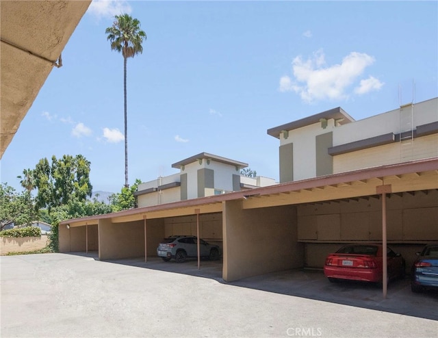 exterior space with a carport