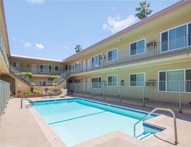 view of pool featuring a patio