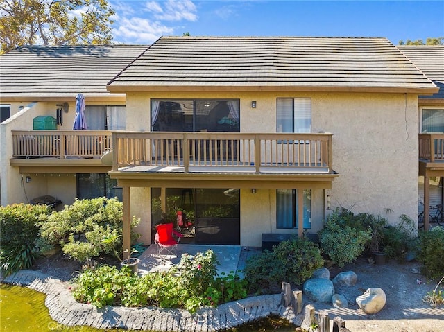 back of house with a balcony