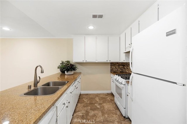 kitchen featuring white appliances, white cabinetry, sink, and decorative backsplash