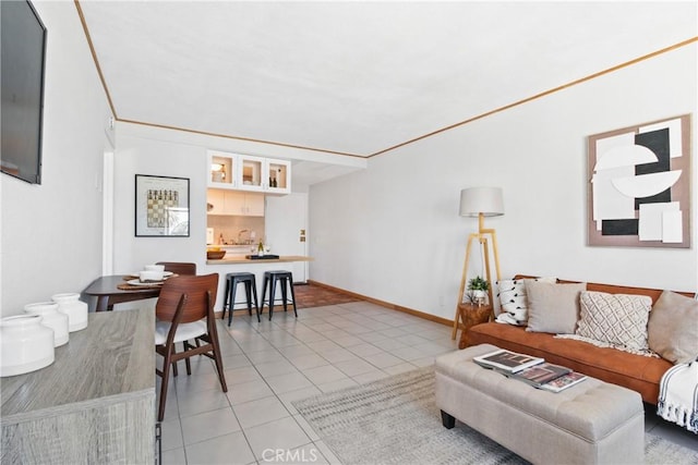 tiled living room with ornamental molding