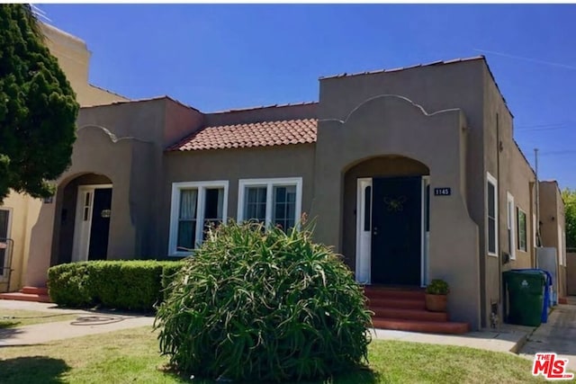 view of front of property with a front lawn