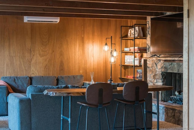 bar featuring a fireplace, a wall unit AC, and wooden walls