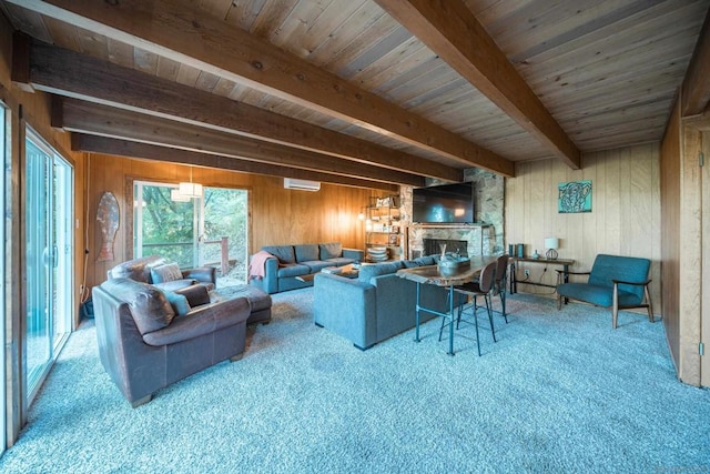 living room with a stone fireplace, wooden walls, beam ceiling, and carpet