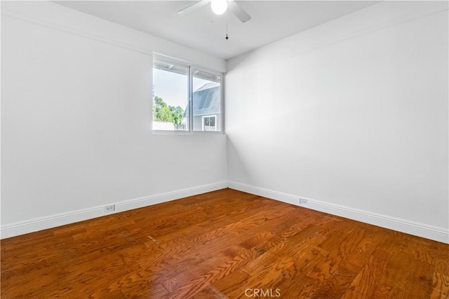 unfurnished room featuring hardwood / wood-style flooring and ceiling fan