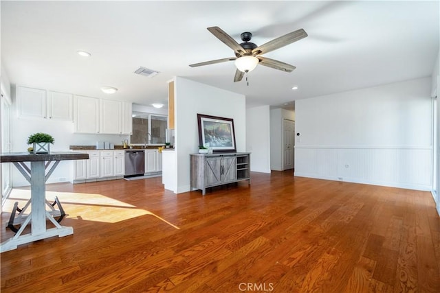 unfurnished living room with ceiling fan, light hardwood / wood-style flooring, and sink