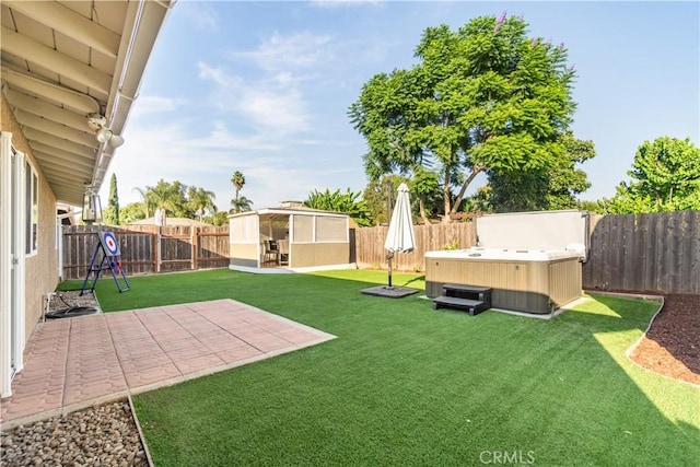 view of yard with a storage unit and a hot tub