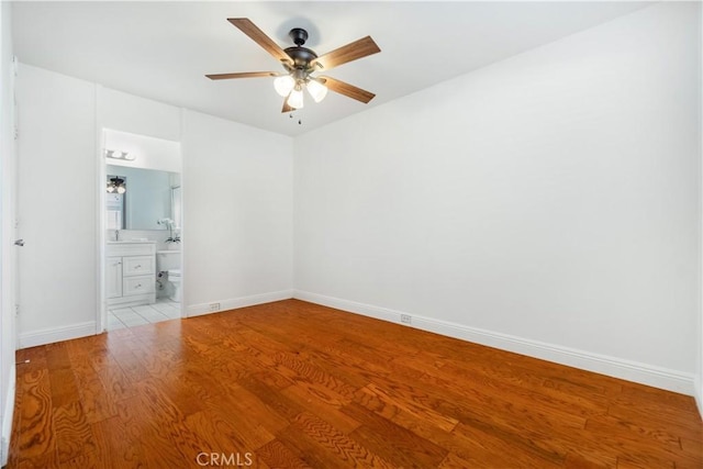 unfurnished room featuring ceiling fan and light wood-type flooring