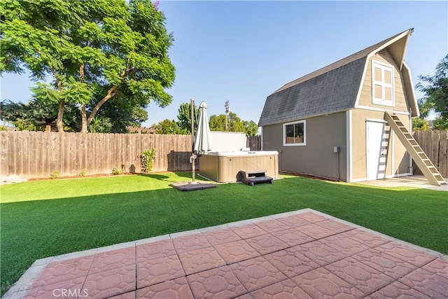 view of yard featuring a fenced backyard, a patio area, an outdoor structure, and a hot tub