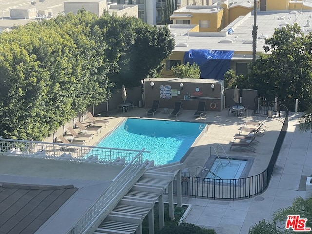 view of pool featuring a patio area