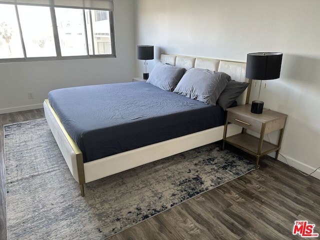 bedroom featuring dark hardwood / wood-style floors