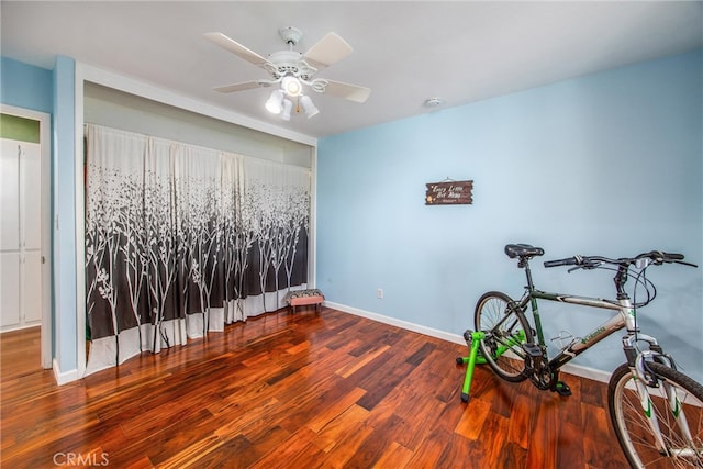 interior space featuring hardwood / wood-style flooring and ceiling fan