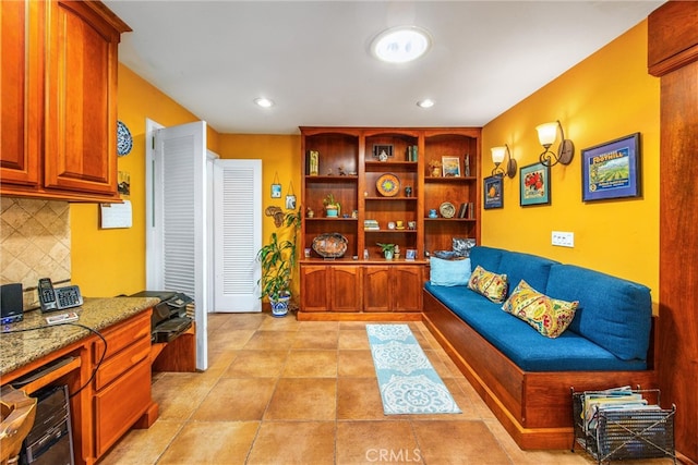 tiled living room with built in desk