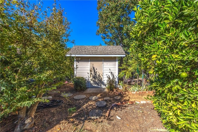 exterior space with a storage shed