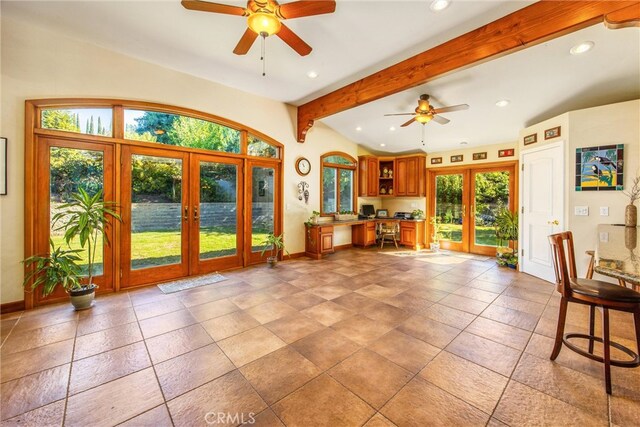 interior space featuring french doors, ceiling fan, and lofted ceiling with beams