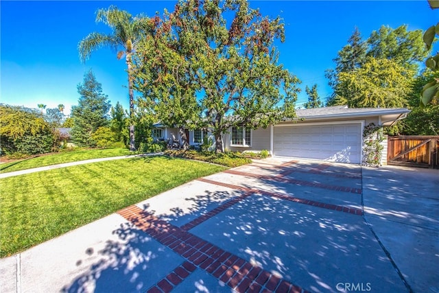 view of front of house with a front lawn and a garage