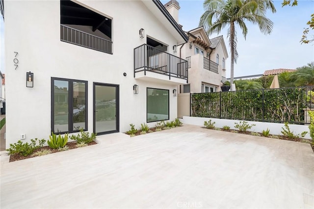 rear view of house featuring a patio