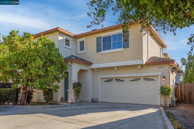 mediterranean / spanish-style home featuring a garage