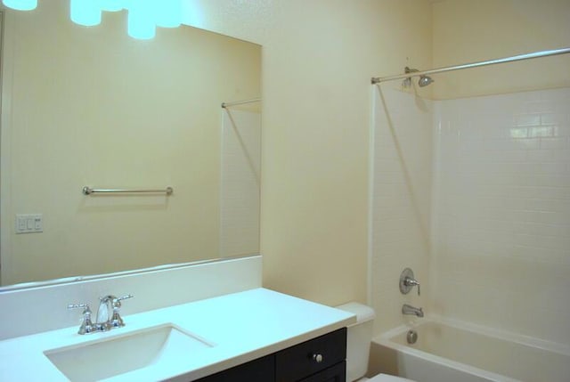 full bathroom with bathing tub / shower combination, vanity, and toilet