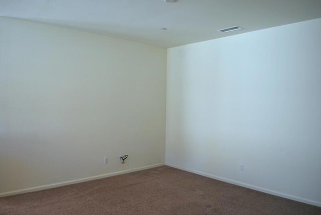 spare room with carpet flooring