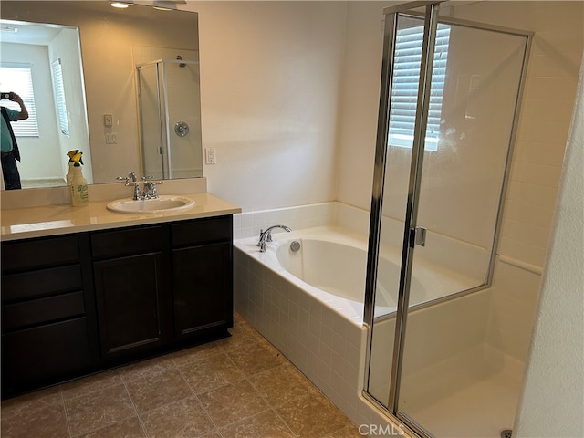 bathroom with vanity, separate shower and tub, and tile patterned floors