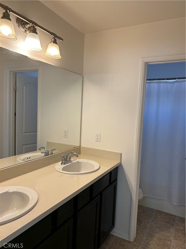 bathroom with vanity, toilet, tile patterned floors, and a shower with curtain