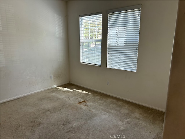 empty room featuring light carpet