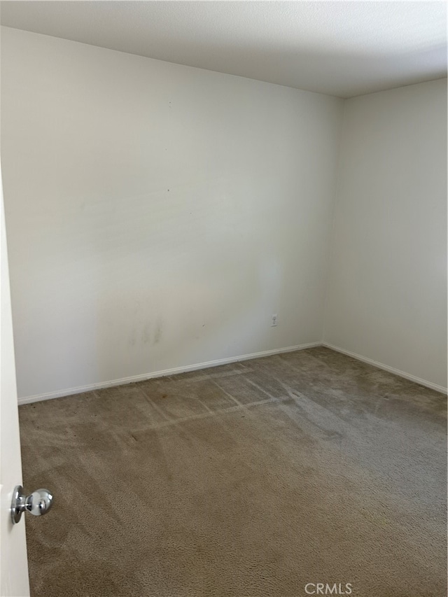 empty room featuring carpet flooring