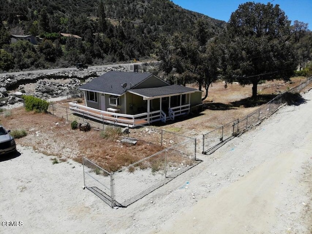 birds eye view of property with a mountain view