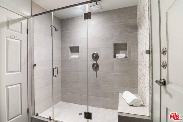 bathroom featuring an enclosed shower