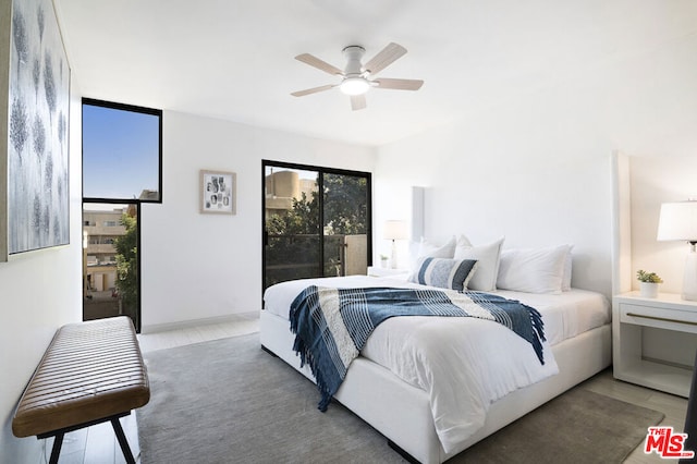 bedroom with wood-type flooring and ceiling fan