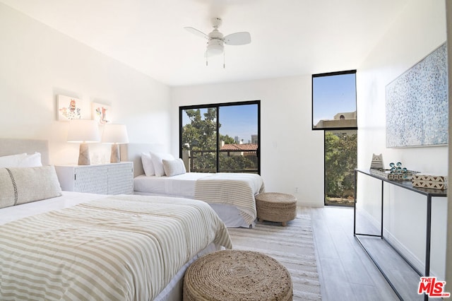 bedroom with access to outside, ceiling fan, and light hardwood / wood-style floors