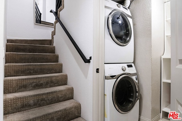 washroom with stacked washer and clothes dryer