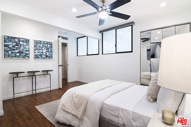 bedroom featuring ceiling fan and dark wood-type flooring