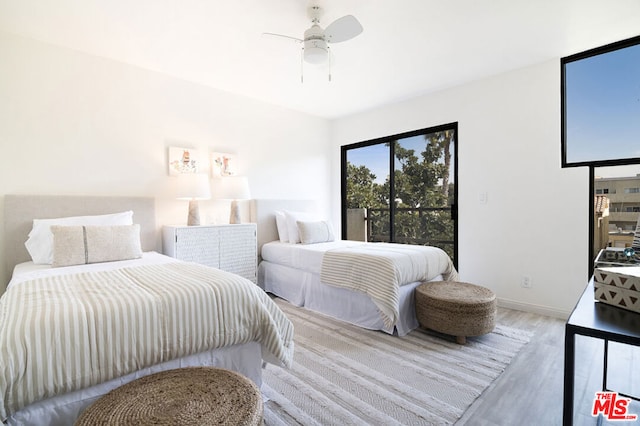 bedroom featuring hardwood / wood-style flooring and ceiling fan