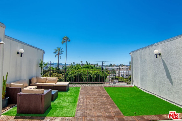 view of yard with an outdoor living space and a patio area