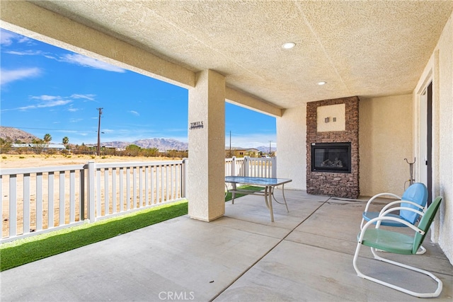 view of patio / terrace with a mountain view