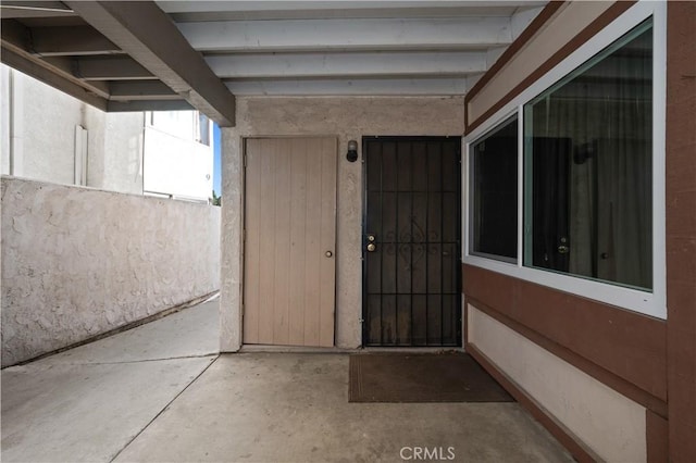 entrance to property featuring a patio