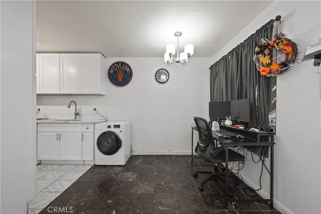 laundry room with an inviting chandelier, sink, and washer / dryer