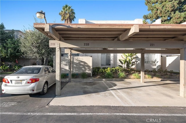 view of vehicle parking with a carport