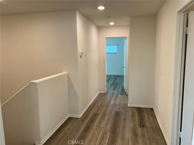 hall with dark hardwood / wood-style flooring