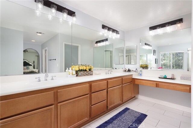 bathroom featuring vanity and tile patterned flooring