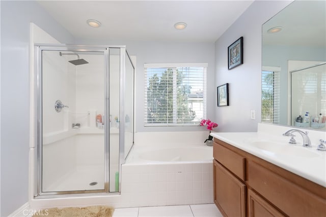 bathroom featuring tile patterned flooring, vanity, and independent shower and bath