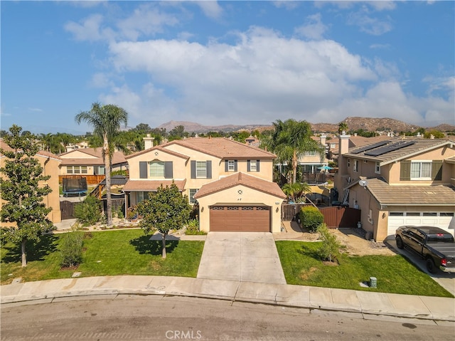 view of front of house featuring a mountain view and a front yard