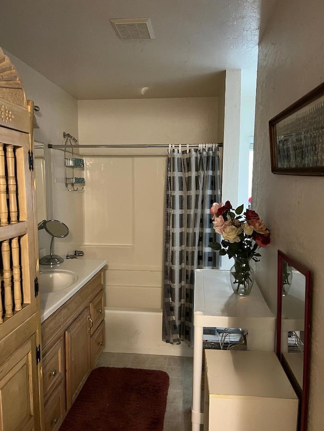 bathroom featuring vanity, tile patterned floors, and shower / tub combo with curtain