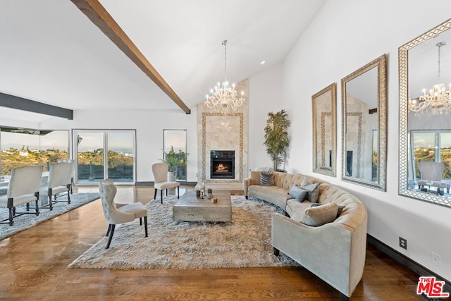 living room featuring plenty of natural light, vaulted ceiling, and dark hardwood / wood-style floors