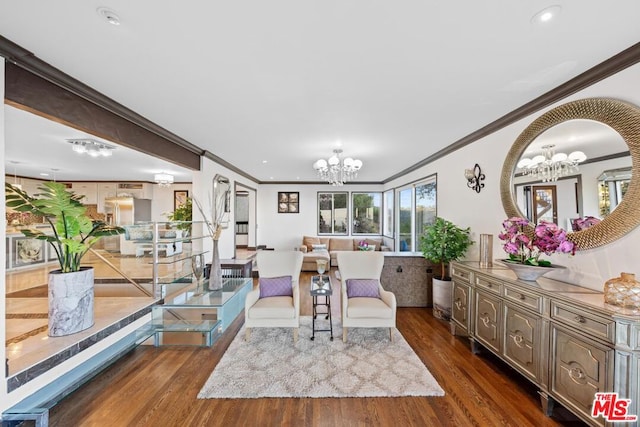 living room featuring crown molding, a chandelier, and dark hardwood / wood-style flooring