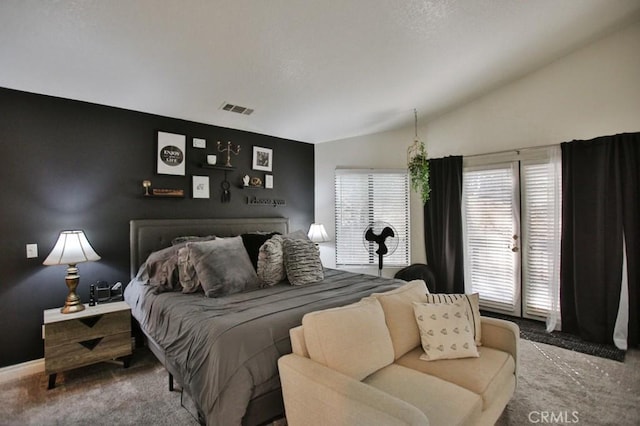 bedroom with carpet floors, baseboards, visible vents, and lofted ceiling